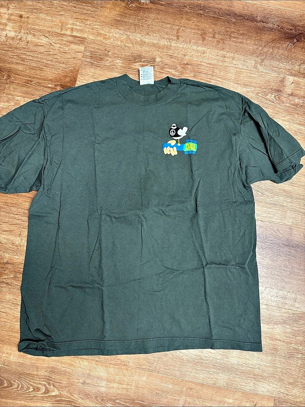 ORIGINAL NEVER WORN. Tultex Woodstock 99 Peace Patrol T-Shirt Green 2XL